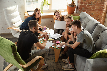 Image showing Group of young caucasian office workers have creative meeting to discuss new ideas