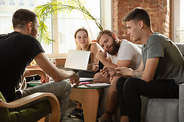 Image showing Group of young caucasian office workers have creative meeting to discuss new ideas