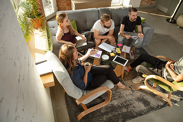 Image showing Group of young caucasian office workers have creative meeting to discuss new ideas