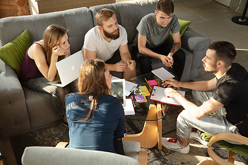 Image showing Group of young caucasian office workers have creative meeting to discuss new ideas