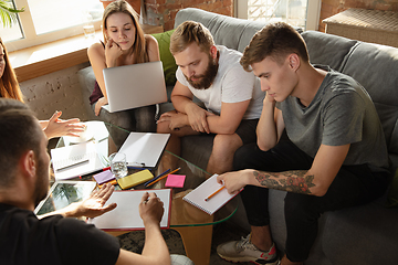 Image showing Group of young caucasian office workers have creative meeting to discuss new ideas