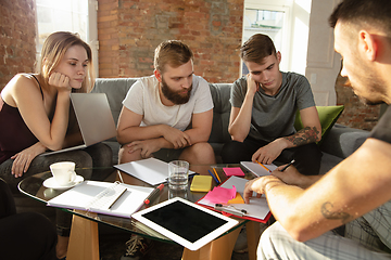 Image showing Group of young caucasian office workers have creative meeting to discuss new ideas