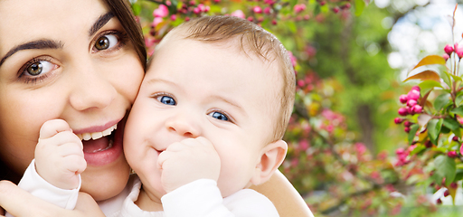 Image showing mother with baby over spring garden background