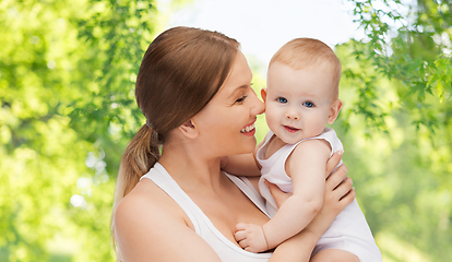 Image showing mother with baby over green natural background