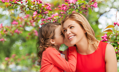 Image showing happy mother and daughter whispering her secret