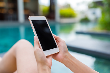 Image showing Using cellphone in swimming pool