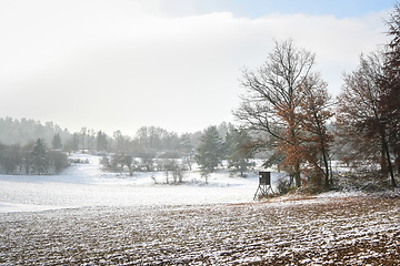 Image showing Snowscape with hunter stand