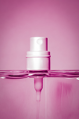 Image showing pink perfume bottle head detail