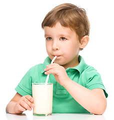 Image showing Cute little boy with a glass of milk