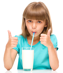 Image showing Cute little girl with a glass of milk