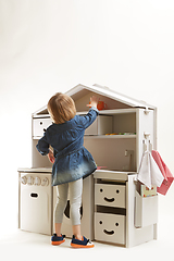 Image showing toddler girl playing with toy kitchen at home