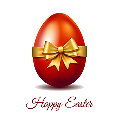 Image showing Red Easter egg tied of gold ribbon