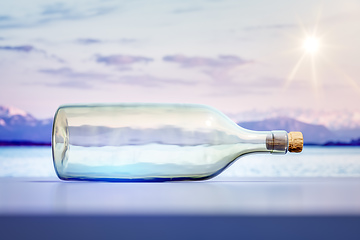 Image showing lying glass bottle landscape scenery background