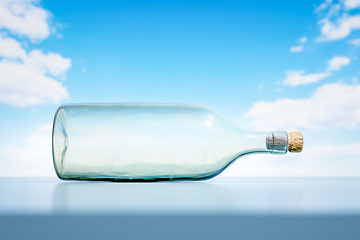 Image showing lying glass bottle landscape scenery background