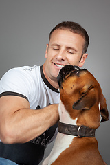 Image showing handsome muscle man with his dog