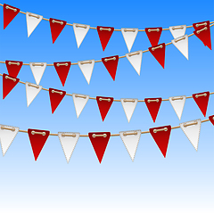 Image showing Red and white flags on sky background.