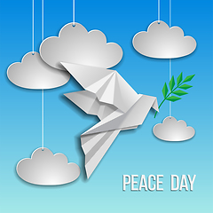 Image showing Peace dove with olive branch flying on blue background