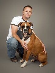 Image showing handsome muscle man with his dog