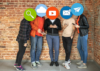 Image showing Creative millenial people connecting and sharing social media. Modern UI icons as heads