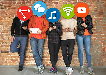 Image showing Creative millenial people connecting and sharing social media. Modern UI icons as heads