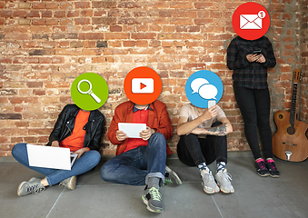 Image showing Creative millenial people connecting and sharing social media. Modern UI icons as heads