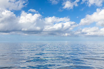 Image showing blue sky with white clouds over the sea