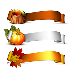 Image showing ribbon with Orange pumpkins, Autumnal leaves and basket full ripe apples