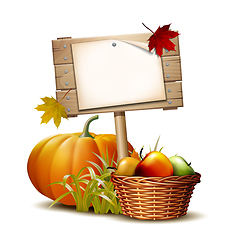 Image showing Wooden banner with Orange pumpkin, Autumnal leaves and basket full ripe apples