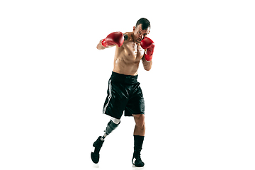 Image showing Full length portrait of muscular sportsman with prosthetic leg, copy space. Male boxer in red gloves.