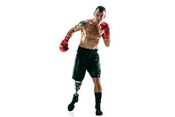 Image showing Full length portrait of muscular sportsman with prosthetic leg, copy space. Male boxer in red gloves.