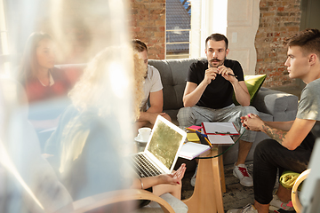 Image showing Group of young caucasian office workers have creative meeting to discuss new ideas