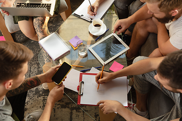 Image showing Group of young caucasian office workers have creative meeting to discuss new ideas