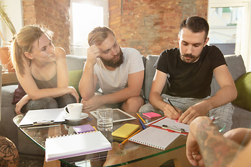 Image showing Group of young caucasian office workers have creative meeting to discuss new ideas