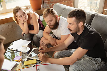 Image showing Group of young caucasian office workers have creative meeting to discuss new ideas