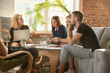 Image showing Group of young caucasian office workers have creative meeting to discuss new ideas