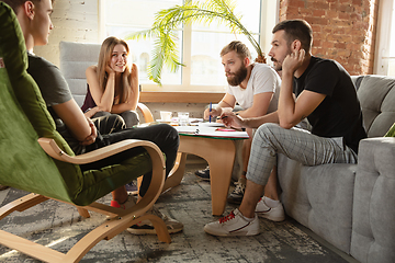 Image showing Group of young caucasian office workers have creative meeting to discuss new ideas