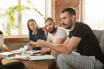 Image showing Group of young caucasian office workers have creative meeting to discuss new ideas