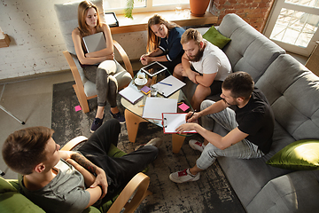 Image showing Group of young caucasian office workers have creative meeting to discuss new ideas