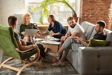 Image showing Group of young caucasian office workers have creative meeting to discuss new ideas