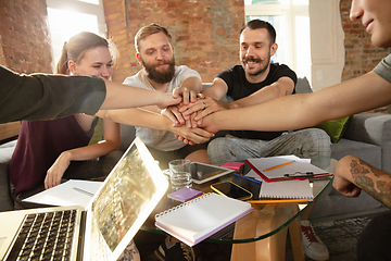 Image showing Group of young caucasian office workers have creative meeting to discuss new ideas