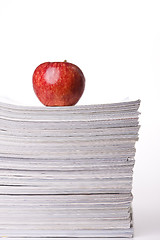 Image showing Apple in a stack of books