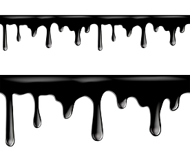 Image showing Black paint dripping isolated on white background.