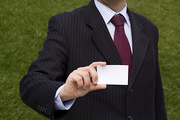 Image showing Businessman showing a blank card