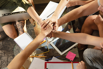 Image showing Group of young caucasian office workers have creative meeting to discuss new ideas