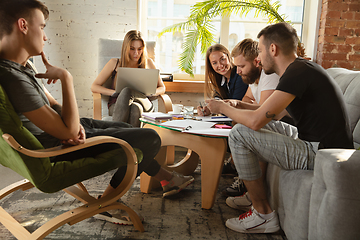 Image showing Group of young caucasian office workers have creative meeting to discuss new ideas