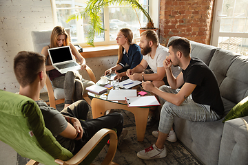 Image showing Group of young caucasian office workers have creative meeting to discuss new ideas