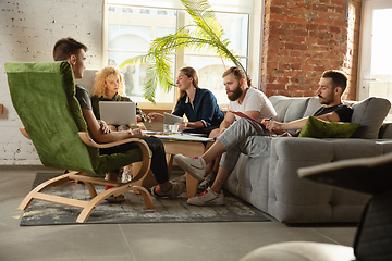 Image showing Group of young caucasian office workers have creative meeting to discuss new ideas