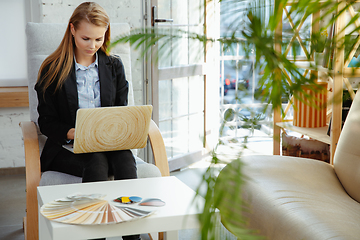 Image showing Interior designer working in modern office. Young business woman in contemporary interior.