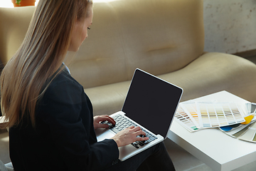 Image showing Interior designer working in modern office. Young business woman in contemporary interior.