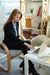 Image showing Interior designer working in modern office. Young business woman in contemporary interior.